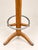 A freestanding coat rack in stained solid beechwood, in the art deco style, circa 1940, bearing the french manufacturer's...