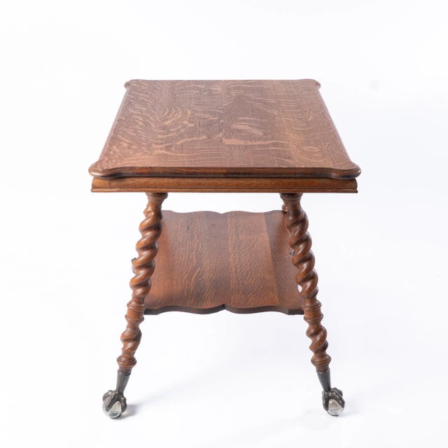 This Antique table was constructed of Tiger Oak around 1900. This sturdy table features a beautiful swirling tiger oak...
