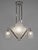 Cleopatra chandelier by H. Petitot A large French 1933 art deco chandelier in nickeled brass or bronze by the famous Paris...