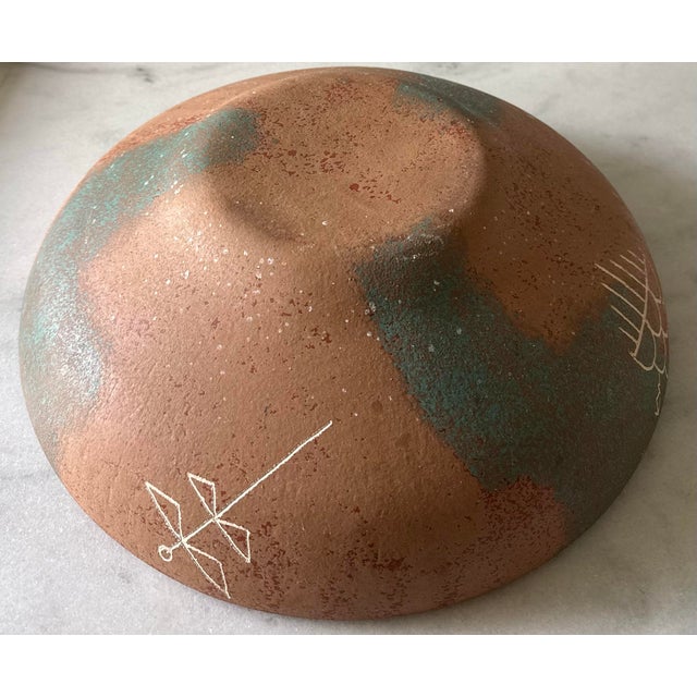 Large vintage studio art pottery bowl featuring unique Southwestern designs including a dragon fly, thunderstorm, animal...