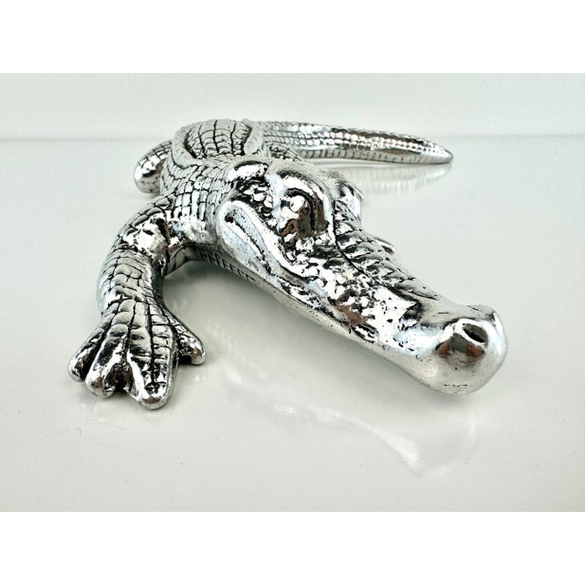 This is a pewter alligator figurine designed by Arthur Court, showcasing his signature nature-inspired aesthetic. Known...