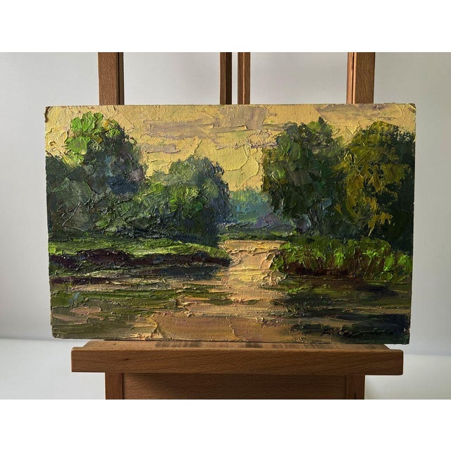 The Oil painting Cardboard titled ""Spring sunset over the river"" presents a radiant celebration of light, color, and...