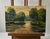 The Oil painting Cardboard titled ""Spring sunset over the river"" presents a radiant celebration of light, color, and...