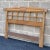 A 1950s headboard by American of Martinsville featuring a rush wrapped sculptural curved walnut top rail over open...