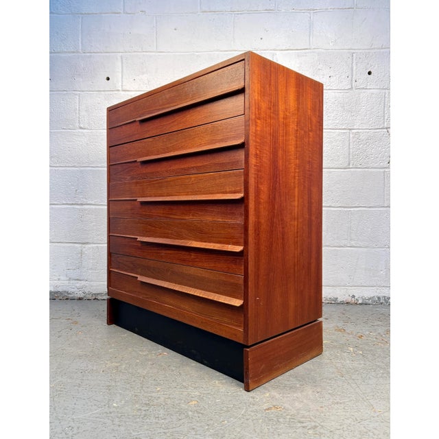 Elegant mid-century dresser crafted in rich Danish teak, showcasing a streamlined form and warm natural grain. Designed...
