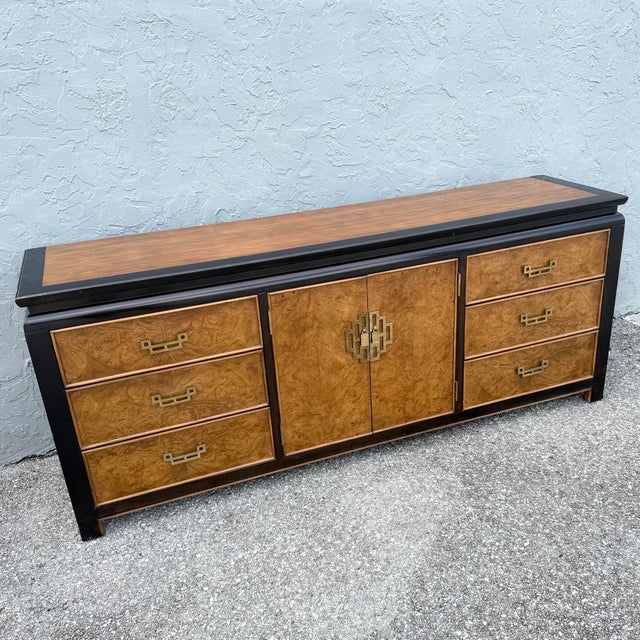 This vintage chinoiserie dresser by Century Furniture combines dramatic black framing with richly patterned burlwood...