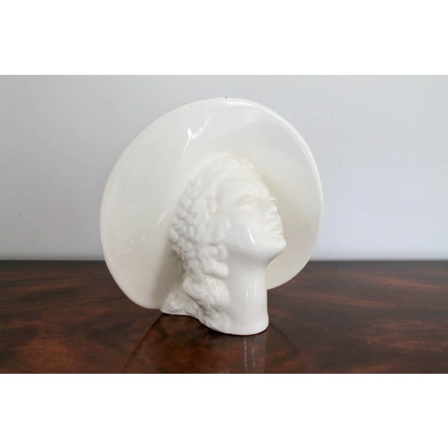 Vintage white ceramic female figural planter. No makers mark. One small chip. Some crazing. Pictured.