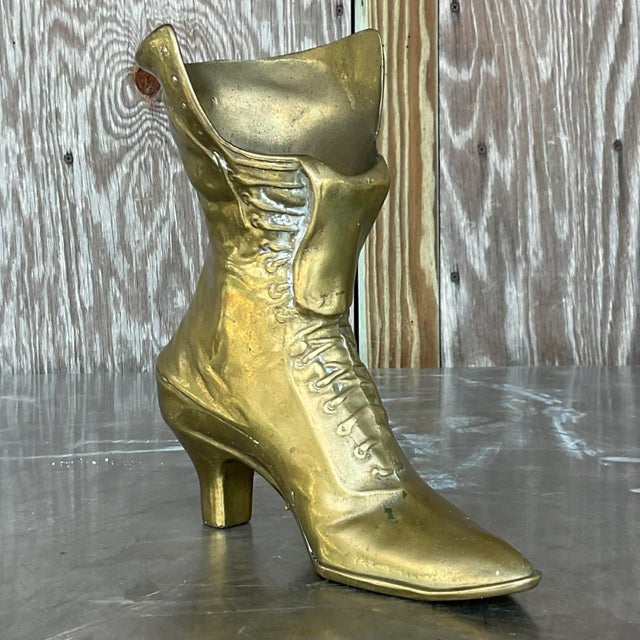 Step into timeless charm with our Vintage Boho Brass Victorian Boot. This ornate piece combines Victorian elegance with...