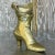 Step into timeless charm with our Vintage Boho Brass Victorian Boot. This ornate piece combines Victorian elegance with...
