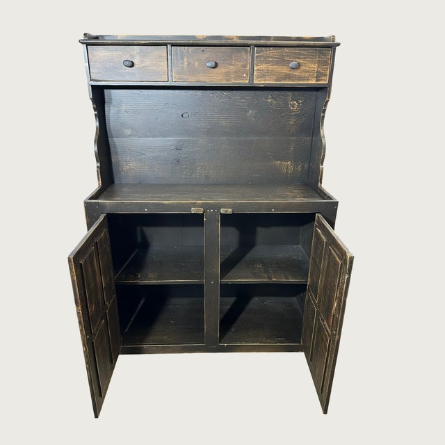 The Colonial is a magnificent, single-piece reproduction of an 18th-century step-back dry sink or kitchen hutch, built for...