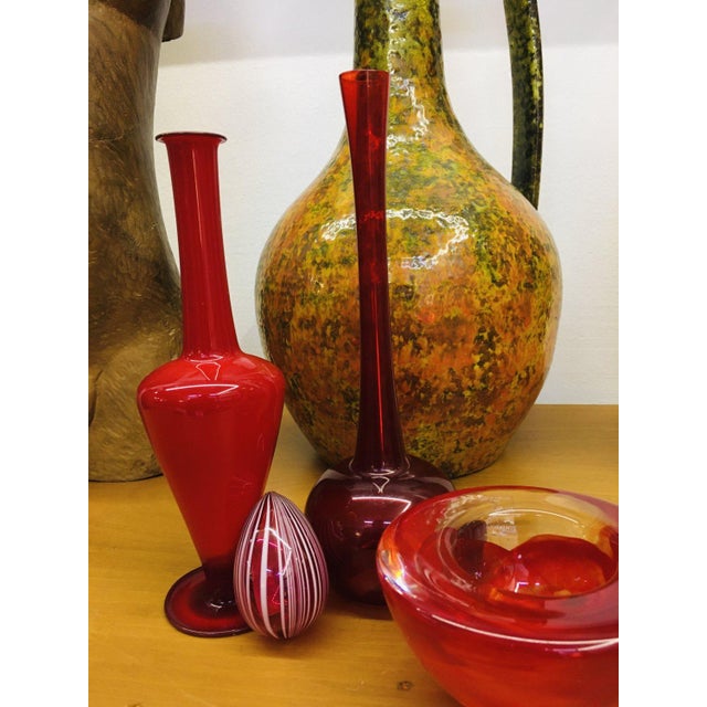 Murano decorative glass egg paperweight on pink background with white stripes, from the 1980's. This handmade glass...