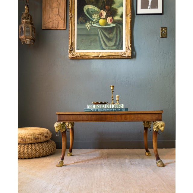This is truly a one-of-a-kind coffee table. The tabletop sits upon four large carved giltwood ram's head capitals at each...