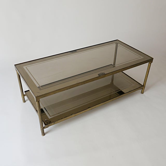 Vintage Brass Coffee Table with Smoked Glass and Mirror from Maison Jansen, 1960s, in Worn conditions. Designed 1960 to...