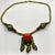 A distinctive vintage Himalayan-style necklace featuring a substantial oval carnelian cabochon suspended from a chain of...