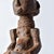 Hand-carved wood Kusu figure with distinct body markings and influence from their Songye and Hemba neighbors. This unique,...