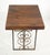 Reclaimed pine wood table top on a wrought iron base. Heart and scroll motifs are featured on the base, complemented by...