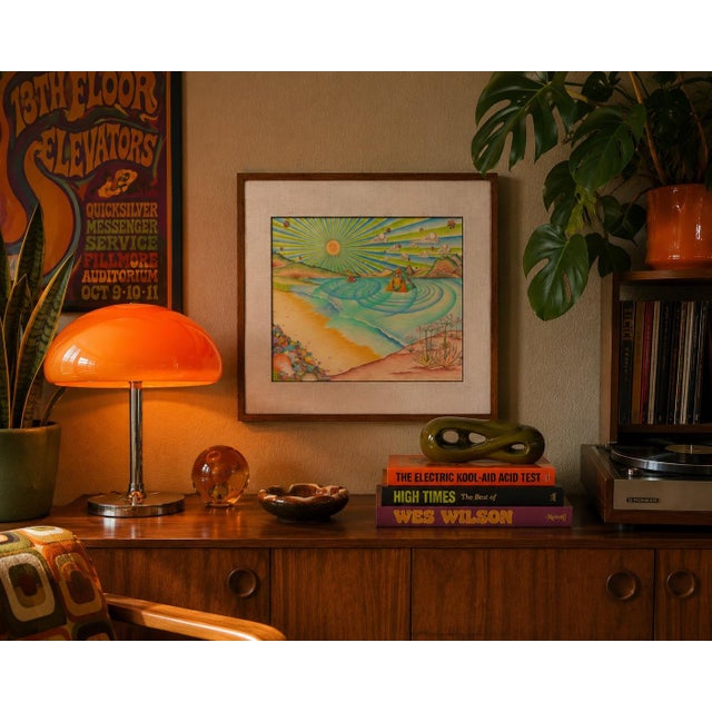 A sunburst beach at the edge of somewhere else — rippling aquamarine water, two pyramids adrift on the tide, agave in...