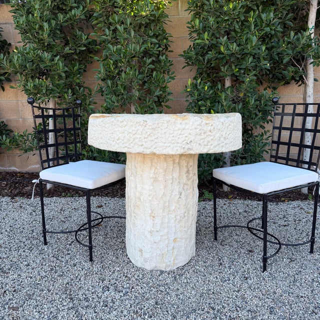 This stunning handcrafted outdoor limestone table, measuring 31" in diameter and standing 32" tall, this embodies the...