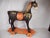 A vibrantly painted and decorated hand carved wooden Temple Horse. This large Horse probably originates from India in the...