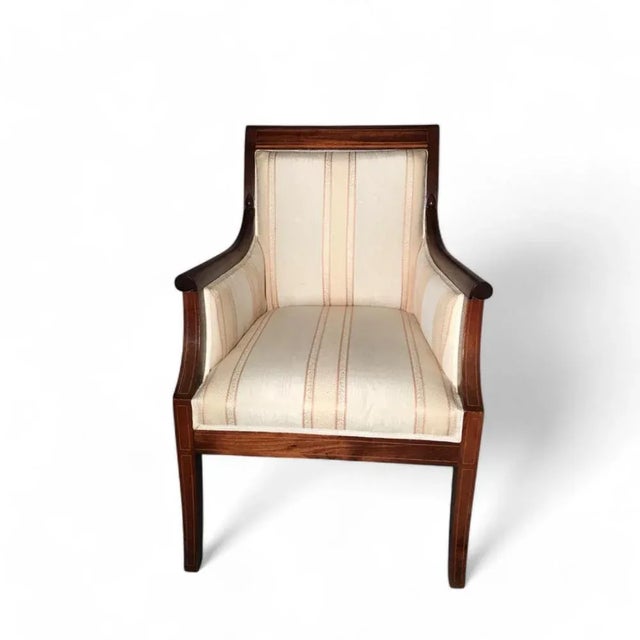 This stunning pair of Directoire-style armchairs, crafted around 1880, epitomizes the refined elegance of 19th-century...