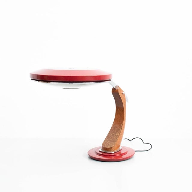 Aluminum and wood table lamp, circa 1960 by fase, manufactured in spain. In original condition, with minor wear consistent...