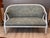 Swedish Gustavian painted settee, 19th C, the curved barrel back sweeping into downswept arms with fluted supports, the...