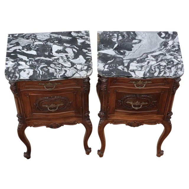 A pair of early 20th-century Italian walnut bedside tables with attractive age, colour, and patina. They are full of...