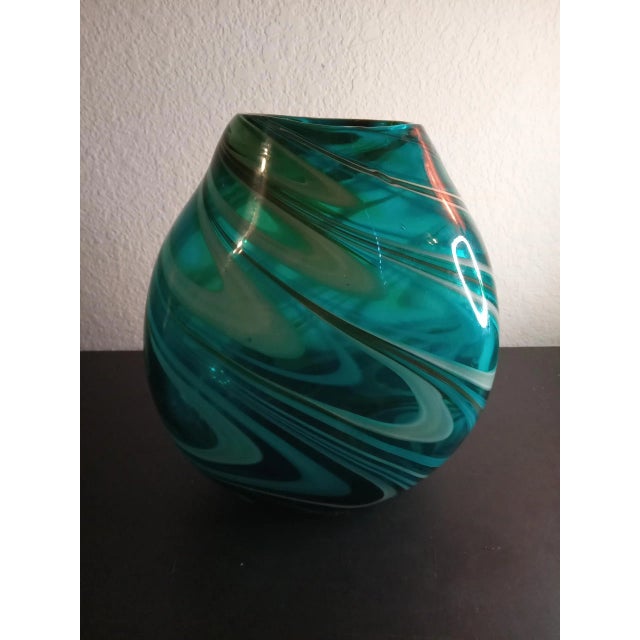 This is a Green Swirl Art Glass 8"x8" Decorative Vase. Matching Taller Vase is sold separately. Procured them at auction