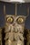 A Mid-Century Brutalist table lamp depicting an owl perched on a branch. The lamp sits on an 8" X 8" X 3/4" travertine...