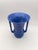 A vintage Camark Pottery vase in a rich matte blue glaze, standing 6.75" tall. The bold trumpet form, stepped base, and...