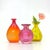 Multi-colored glass vases, group of 3. This mixed group of rounded transparent vases is in a pink, orange, and yellow...