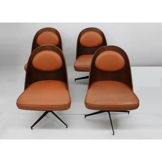 These beautiful dining chairs come to you with a beautiful body made of bent plywood and upholstered seats with orange...