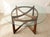 A striking 1960s dining table attributed to Adrian Pearsall, featuring a sculptural wood base beneath a substantial round...