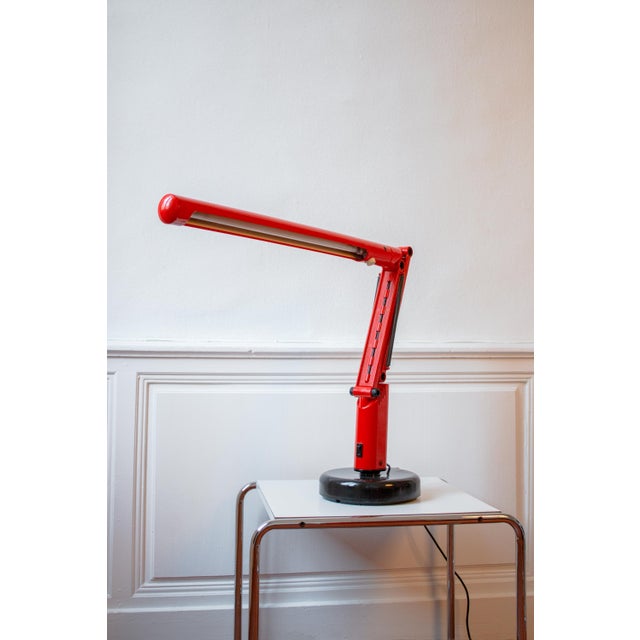 Graphic, functional, and a collector's item, this desk lamp is the lucifer model, designed in 1975 by the swedish design...