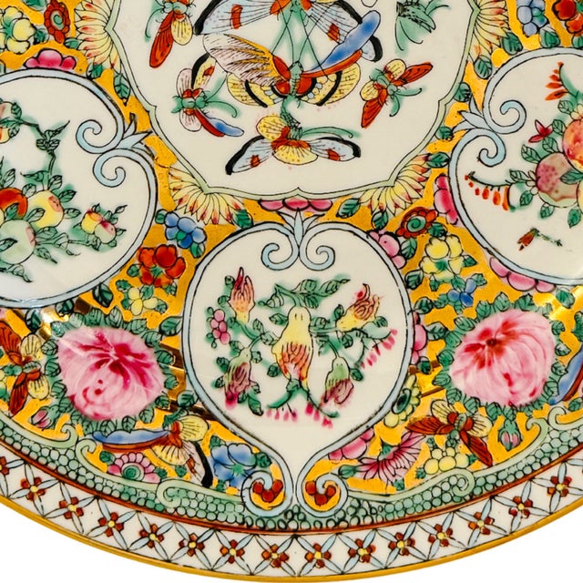 Featuring a uniquely stylized layout, this vintage Famille Rose Canton porcelain plate stands out for its lotus-shaped...