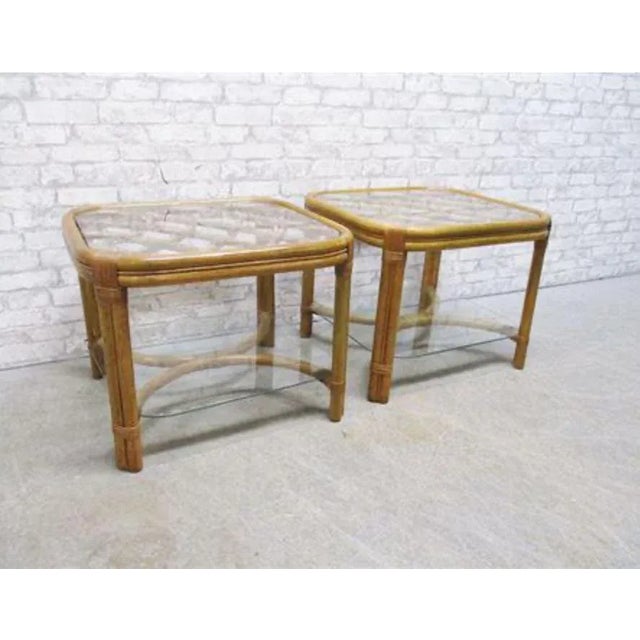McGuire style rattan / bamboo end tables with glass tops. In beautiful condition! Top and bottom shelf glass Both glasses...