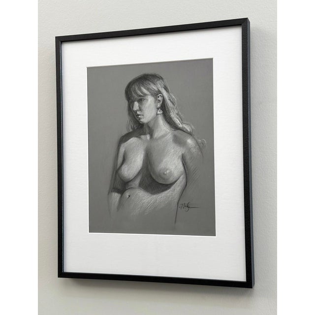 This artwork presents a striking figure study rendered in charcoal and pastel, showcasing a contemplative pose that...