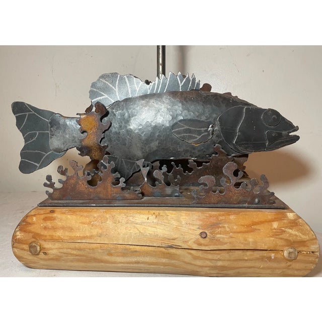 Crafted with a keen eye for detail, this Vintage handmade Folk Art sculpted steel Fish table lamp stands as a testament to...