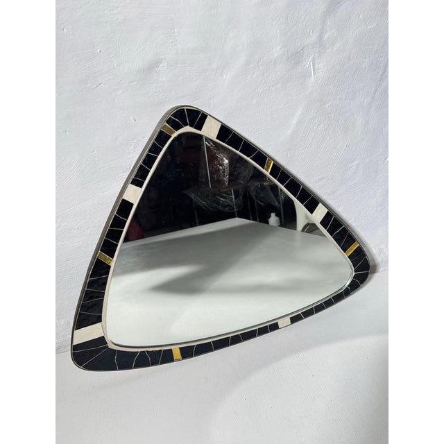 An exceptional and highly collectible organic "free-form" wall mirror, hand-crafted in West Germany during the 1950s. This...