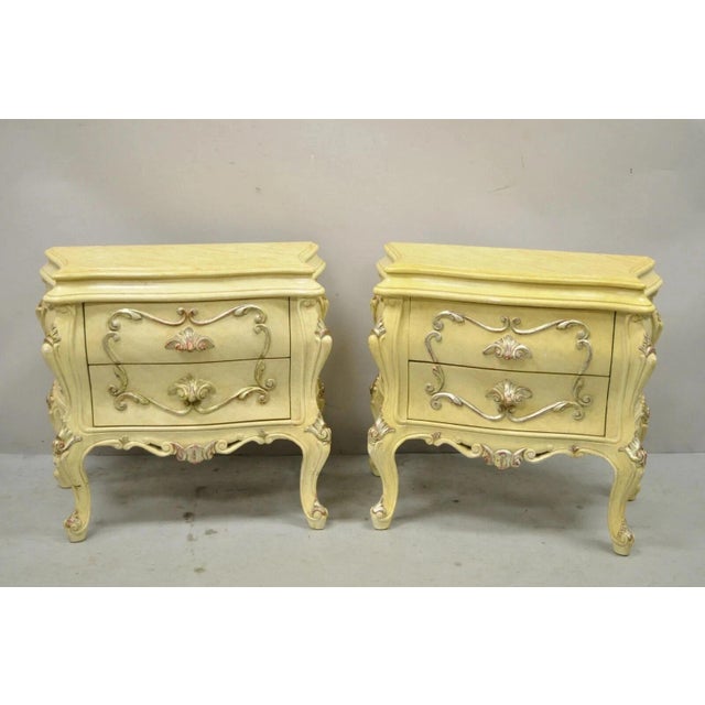 Vintage Italian Rococo Style Cream Lacquer 2 Drawer Bombe Nightstands - a Pair. Item features a distressed finish, nicely...