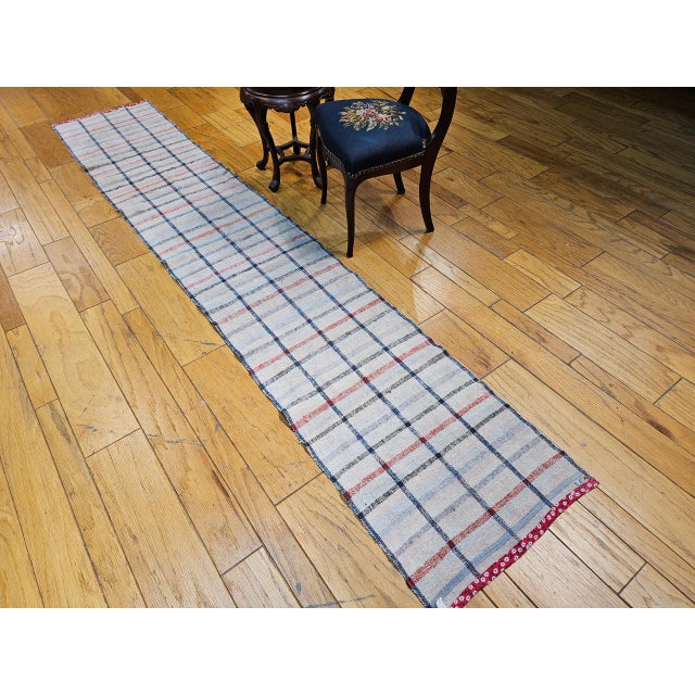 Vintage American Rag Runner, a beautifully handwoven textile that blends traditional craftsmanship with a clean, modern...