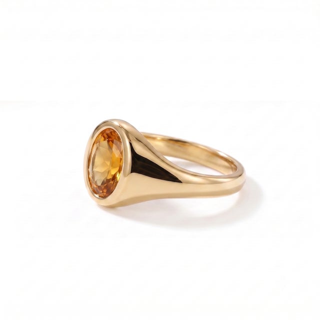 Celebrate timeless elegance with this beautifully crafted Natural Citrine Signet Ring, featuring a vibrant 7 x 5 mm oval-...