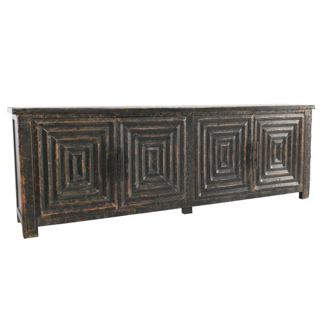 Solid reclaimed wood sideboard with distressed rich black finish contrasting with exposed warm wood tones. Four geometric...