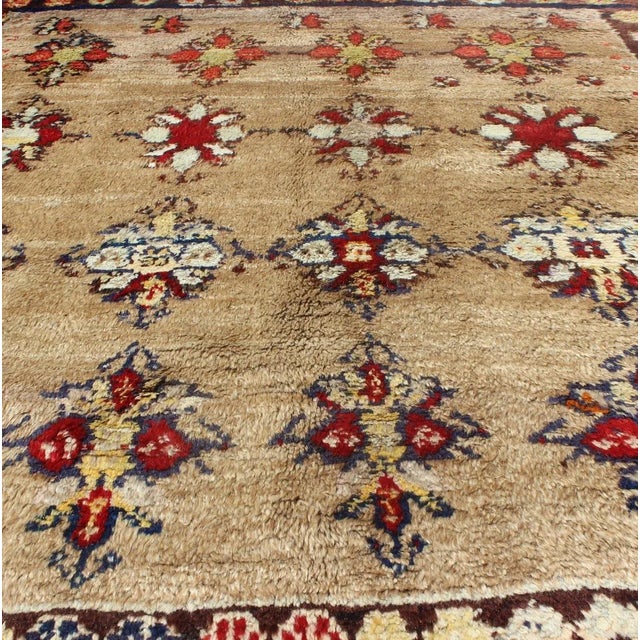 Textile Early 20th Century Angora Turkish Tulu Carpet With Colorful Floral Designs Set on Sand Field For Sale - Image 7 of 12