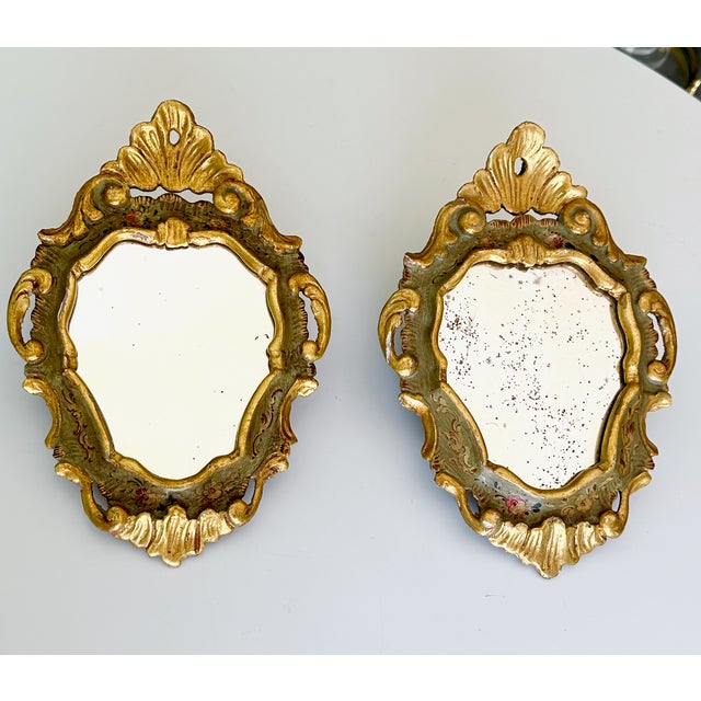 Pair small scale decorative vintage Italian Venetian-style wall mirrors, featuring ornate gold gilt and painted frames...