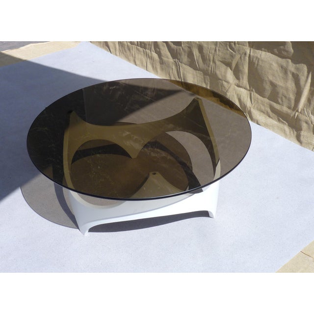 Coffee table with lacquered wood base (white) and smoked glass top, 110cm diameter. Beautifully crafted bentwood, giving...