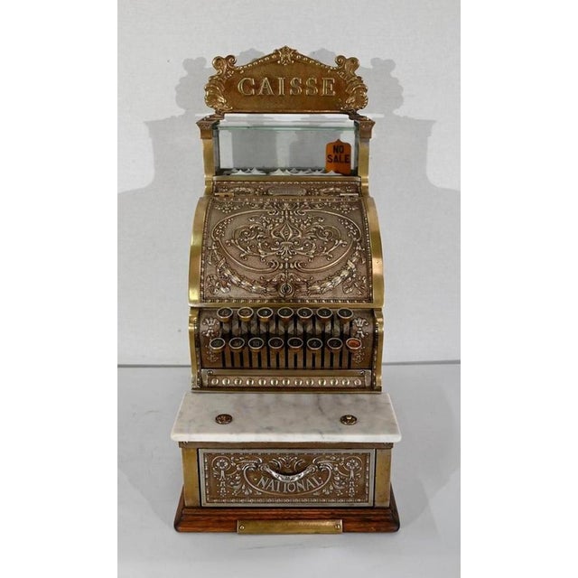 Remarkable little cash register of the American company "National Cash Register", a company which marketed for the first...