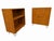 This set of two vintage Danish modern teak hairpin storage cabinets exudes Mid-Century Modern style with its brown teak...