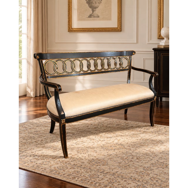 An elegant vintage settee by Maitland-Smith, featuring a dramatic black lacquered frame accented with hand-applied gilt...