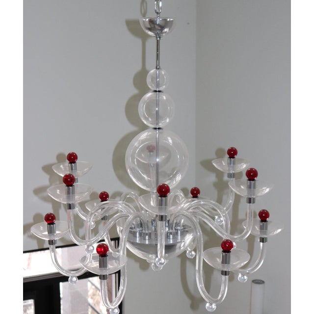 Murano Hand Blown Crystal Glass 12 arms Chandelier. Chromed metal stem and canopy. Made and designed by Aureliano Toso....